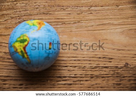 blue globe map lie on wooden table save earth world globe ball for educational