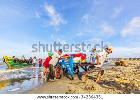 VUNG TAU, VIETNAM - AUG 22,2015: Fishermen on beach at the Fishing Village Long Hai, Vietnam.