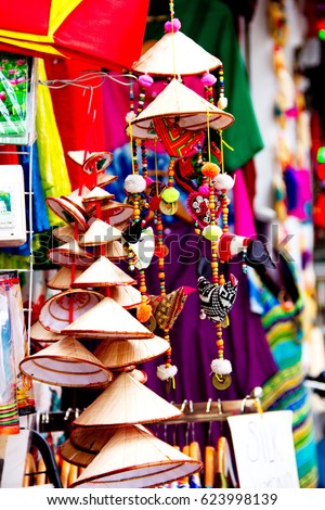 Vietnamese hats souvenir, vietnamese traditional conical hats hanging on wire for decoration, multi sized for vietnamese hats, popular souvenir from Hanoi, Vietnam.