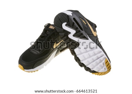 BURGAS, BULGARIA - DECEMBER 29, 2016: Nike Air MAX women's shoes - sneakers in black, isolated on white, with clipping path. Nike is a global sports clothes and running shoes retailer.