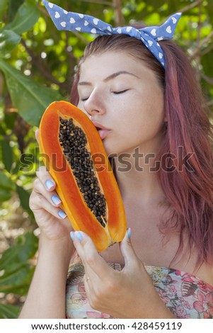 stock-photo-young-woman-with-papaya-4284
