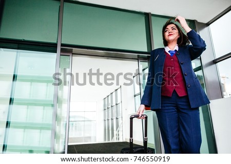 Stewardess in uniform out of the building after flight