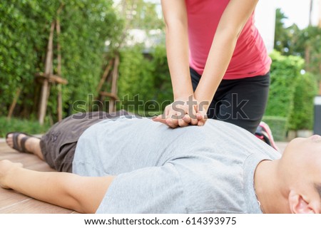 https://thumb7.shutterstock.com/display_pic_with_logo/3752801/614393975/stock-photo-woman-giving-cardiopulmonary-resuscitation-cpr-to-a-man-at-public-park-614393975.jpg
