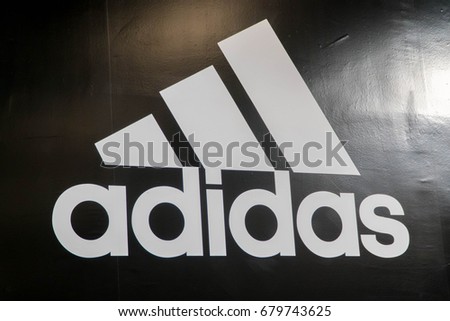 MELAKA, MALAYSIA - JULY 8, 2017: Adidas logo. Adidas is a German multinational corporation, headquartered in Herzogenaurach, Germany, designs and manufactures shoes, clothing and accessories.