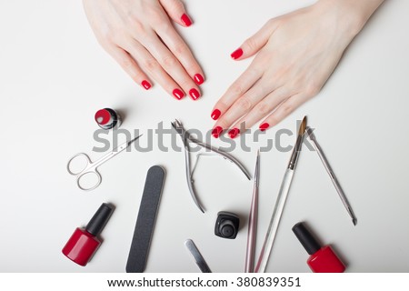 Manicure - Beautiful manicured woman's nails with red nail polish