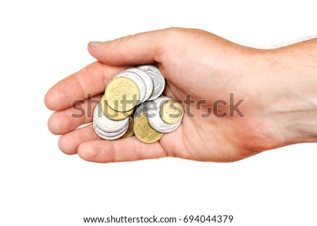 stock-photo-a-handful-of-coins-in-the-pa