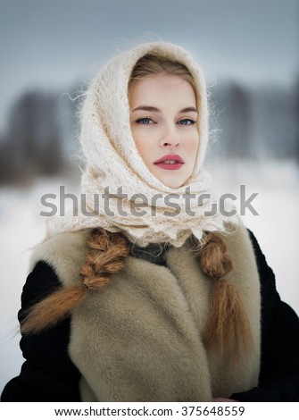 https://thumb7.shutterstock.com/display_pic_with_logo/384643/375648559/stock-photo-beautiful-russian-woman-in-a-traditional-dress-russian-village-winter-375648559.jpg