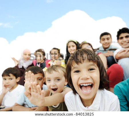 Crowd of children, sitting together happily