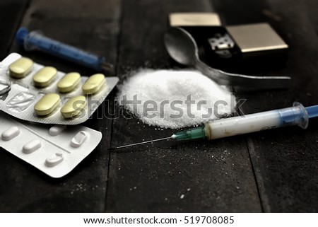 Hard drugs on dark table