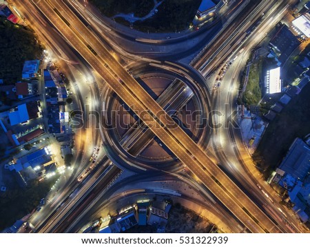 Road roundabout large Aerial The road beautiful at Night , Bird Eye View in bangkok , top view , Bangkok , Thailand .