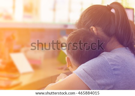 Behind view Mother and Sun kissing and hugging. Happy Family,copy space.filter color effect.