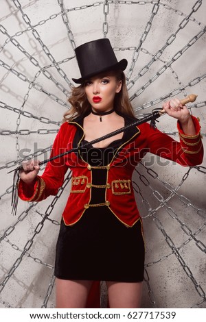 https://thumb7.shutterstock.com/display_pic_with_logo/398806/627717539/stock-photo-beautiful-woman-trainer-in-a-circus-suit-and-a-hat-627717539.jpg