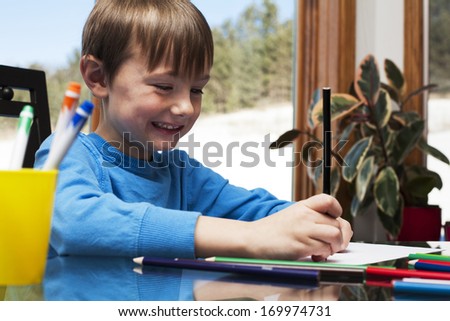 Young boy doing his homework at home