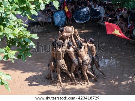BAC GIANG, VIET NAM, May 20, 2016 man team, Van village, Bac Giang, Vietnam. participate in the festival competition ball, traditional materials, on the mud, very unique, the legacy of Vietnam