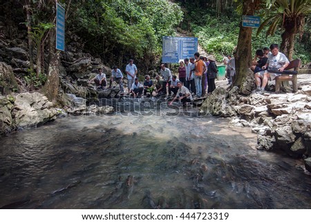 THANH HOA, Vietnam, June 17, 2016 the group of tourists to visit, fish, swim where the water springs, resorts, Thanh Hoa, Vietnam