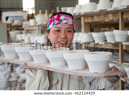 HAI DUONG, Vietnam, July 25, 2016 portrait, woman (name unknown), a worker, Chu Dau pottery, Hai Duong Province, Vietnam