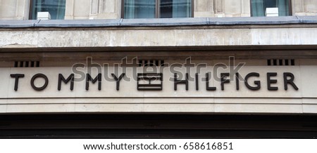 LONDON - AUGUST 6: A London Tommy Hilfinger store logo is shown here on August 6, 2015. There are over 1,400 Tommy Hilfiger stores in over 90 countries