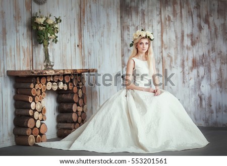 https://thumb7.shutterstock.com/display_pic_with_logo/4087738/553201561/stock-photo-portrait-of-a-beautiful-fashion-bride-wreath-with-flowers-on-shiny-blonde-hair-romantic-girl-in-553201561.jpg
