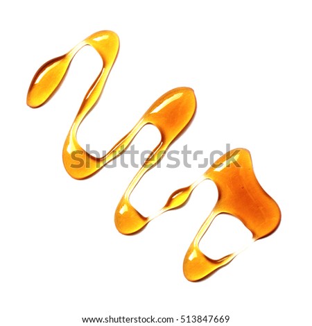 Honey drop isolated on white background.Spots.View top
