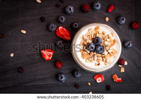 Breakfast with yogurt, muesli and fruits. Fresh yogurt. Healthy food concept. Top view, flat lay