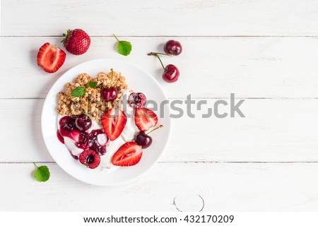 Breakfast with yogurt, muesli and berries. Fresh yogurt. Healthy food concept. Top view, flat lay
