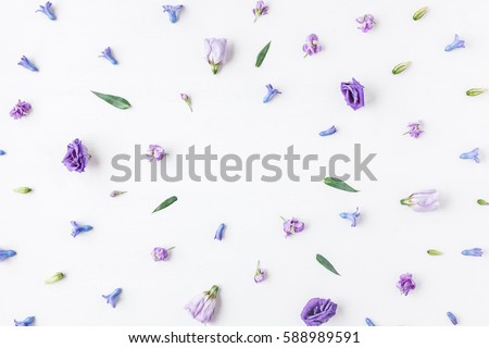 Flowers composition. Frame made of various colorful flowers on white background. Flat lay, top view.