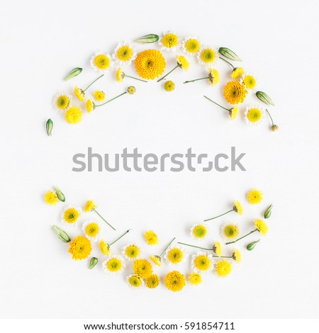 Flowers composition. Wreath made of various yellow flowers on white background. Easter, spring, summer concept. Flat lay, top view