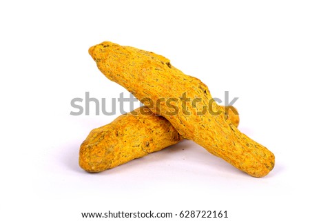 turmeric powder with fresh turmeric root in white