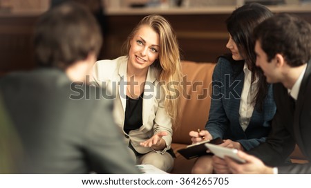 A group of successful businessmen. Discussion of the important contract of the company.