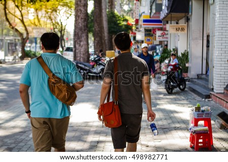 Crowd on street with beautiful morning light, Ho Chi Minh City, Vietnam, Asia.