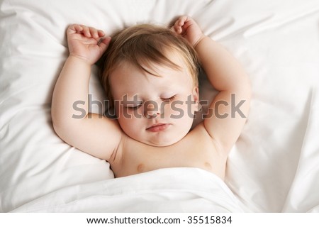 Baby sleeping in bed