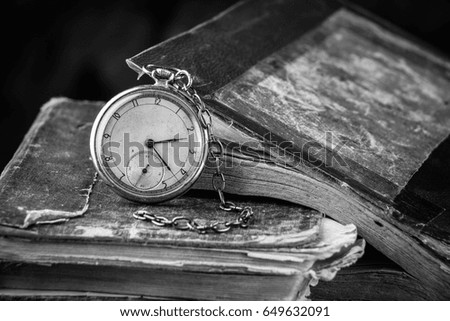 Decaying Clock On The Background Of Old Shabby Wise Books Black And White Photography Decaying Clock On The Background Of Old Shabby Wise Books Black And White Photography