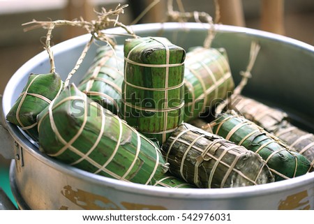Tet cake (Banh Tet) is a cake made primarily from glutinous rice, which is rolled in a banana leaf into a thick, log-like cylindrical shape, with a mung bean and pork filling, then boiled.