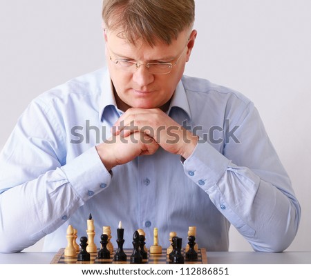 Man playing chess, isolated on white background