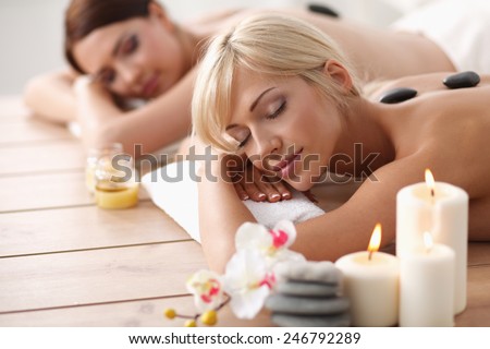 Two young beautiful women relaxing and enjoying at the spa