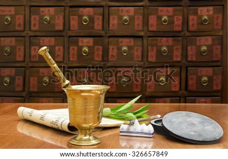 Traditional Chinese medicine shop (manual focus on the brass mortar)