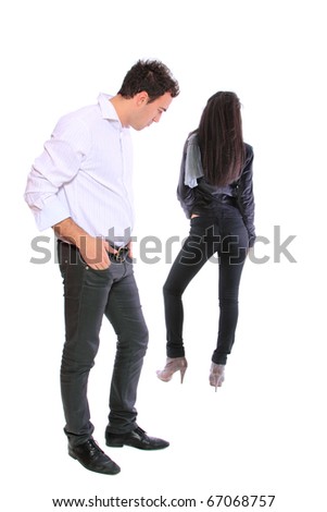 portrait of a nice young couple - Man is looking at woman;s behind