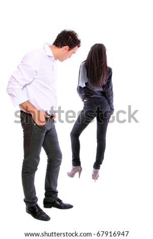portrait of a nice young couple - Man is looking at woman;s behind