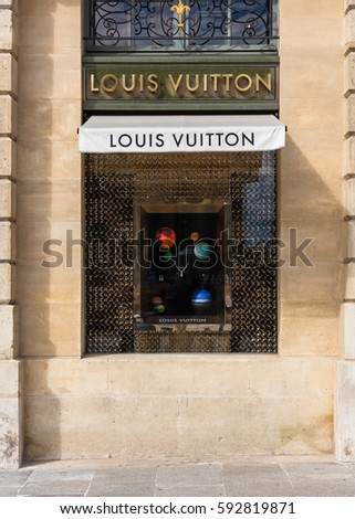 Paris, France - July 02, 2016: Louis Vuitton shop window in place Vendome in Paris. Louis Vuitton or shortened to LV, is a French fashion house founded in 1854 by Louis Vuitton
