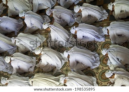 TAY NINH, VETNAM - JULY 26: Religious ceremony in Cao Dai Temple on July 26, 2012 in Tay Ninh, Vietnam. Estimates of the number of Cao Dai adherents in Vietnam to 2 to 3 million.