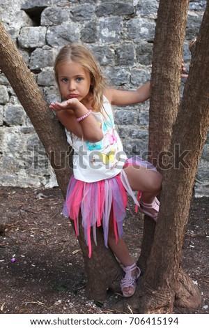 https://thumb7.shutterstock.com/display_pic_with_logo/4494571/706415194/stock-photo-portrait-of-a-beautiful-little-girl-in-mini-skirt-706415194.jpg