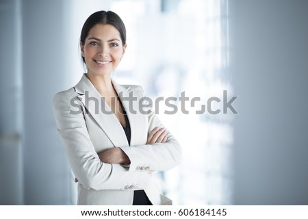 Smiling Female Business Leader With Arms Crossed