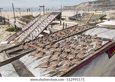 Drying mackerel fish for sale on the beach of Nazare, Portugal