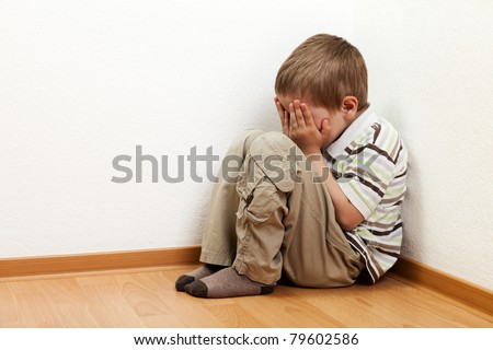 Little child boy wall corner punishment standing
