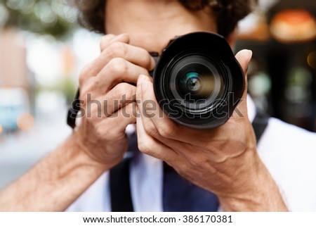 Male photographer taking picture