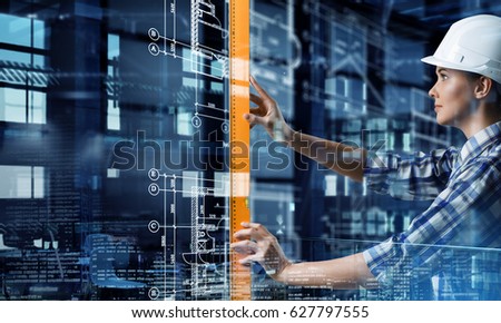 Builder woman taking measures