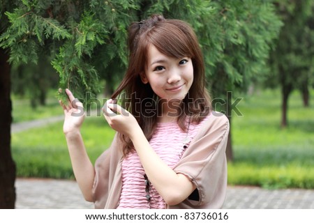 https://thumb7.shutterstock.com/display_pic_with_logo/472525/472525,1314754477,1/stock-photo-a-lovely-asian-woman-in-a-park-grass-plot-83736016.jpg