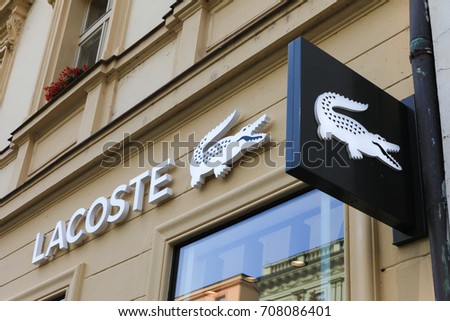 Prague, Czech Republic - August 27, 2017: Lacoste sign on a store. Lacoste is a French clothing company that sells high-end clothing, footwear, perfume, leather goods, and most famously polo shirts