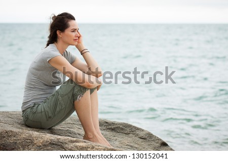 http://thumb7.shutterstock.com/display_pic_with_logo/476302/130152041/stock-photo-a-sad-and-depressed-woman-sitting-by-the-ocean-deep-in-thought-130152041.jpg