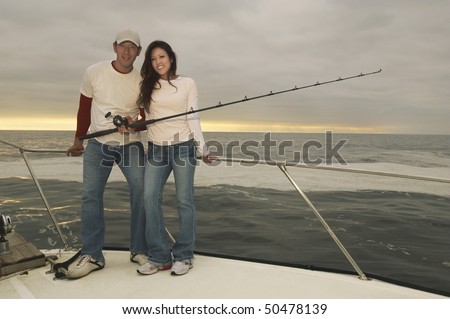 https://thumb7.shutterstock.com/display_pic_with_logo/487144/487144,1270717254,319/stock-photo-couple-on-fishing-boat-portrait-50478139.jpg